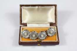 A Pair of Platinum Mother of Pearl and Seed Pearl Cufflinks