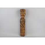 A Wood Carved Wall-Mounted Fertility Figure