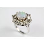 A Platinum Mounted Opal and Diamond Ring