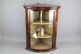 A Glaze-fronted Mahogany Corner Cabinet