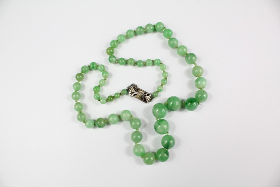 A Chinese Graduated Jade Necklace