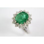 An 18ct White Gold Emerald and Diamond Cluster Ring