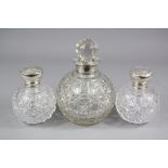 Two Victorian Cut-glass Silver Topped Perfume Bottles