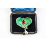 An Art Nouveau Silver Gilt Enamel and Mabe Pearl Thistle Brooch
