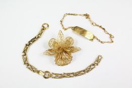 A 14ct Gold Part Bracelet, Identity Bracelet and Filigree Floral Brooch
