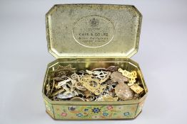 A Vintage Tin of Military Badges