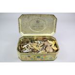 A Vintage Tin of Military Badges