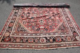 A Large Woollen Persian Carpet