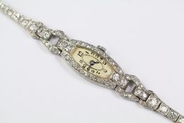 An Art Deco Platinum and Diamond Cocktail Watch Bracelet