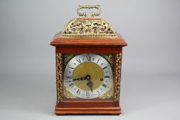 A 20th Century Brass and Mahogany Mantel Clock