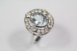 A Lady's Platinum Aquamarine and Diamond Ring