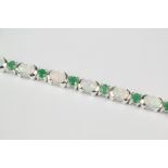 A Silver Opal and Emerald Bracelet