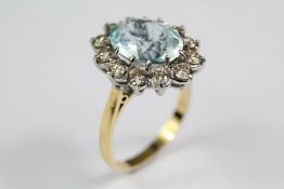 An 18ct Yellow Gold Aquamarine and Diamond Ring