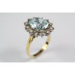 An 18ct Yellow Gold Aquamarine and Diamond Ring