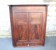 An Antique Mahogany Corner Cupboard