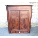 An Antique Mahogany Corner Cupboard