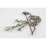 A Sterling Silver and White Stone Brooch