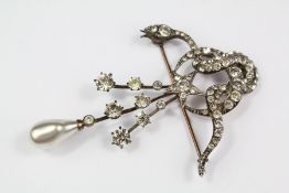 A Sterling Silver and White Stone Brooch