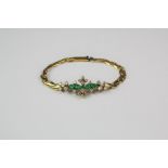 An 18ct Yellow Gold Diamond and Emerald Bracelet