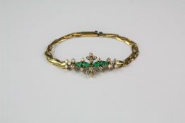 An 18ct Yellow Gold Diamond and Emerald Bracelet