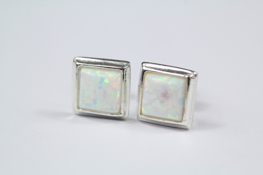 A Pair of Silver and Opal Stud Earrings