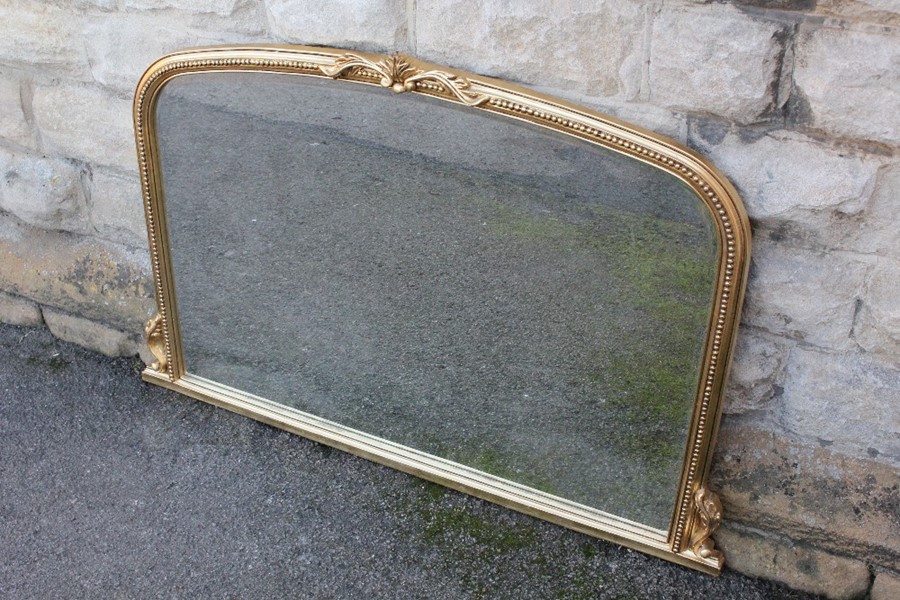 A Large Bevelled Overmantel Mirror