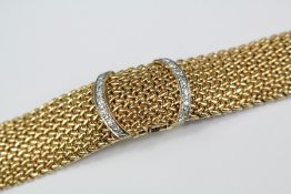 A Lady's Art Deco 14ct Yellow Gold and Diamond Genève Bracelet Watch