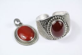 An Indonesian Silver and Cornelian Bangle and Pendant