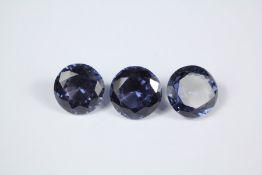 Three Loose Circular Amethyst-Style Stones.