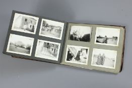 A Small Brown Photograph Album