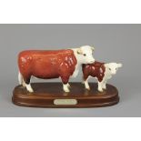 A Beswick Hereford Cow and Calf Figurine