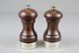 A Pair of Rosewood and Silver Salt and Pepper Mills