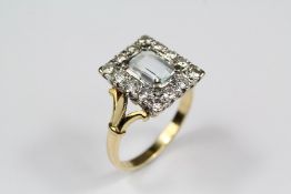 An 18ct Yellow Gold Diamond and Aquamarine Ring