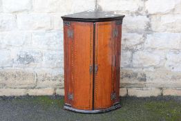 An Antique Mahogany Corner Cupboard