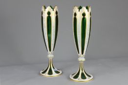 A Pair of Bohemian Green Glass and White Enamel Overlay Vases