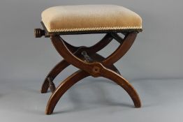 An Edwardian Mahogany X-frame Piano Stool