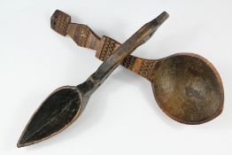 A Carved Pointed Wooden Ladle