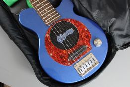 A Vintage Pig Nose Travelling Guitar