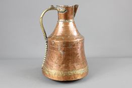 A Middle Eastern Copper and Brass Ewer