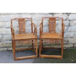 A Pair of Chinese Hardwood "Throne" Chairs