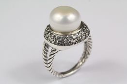A Silver and Pearl Ring