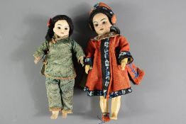 Two Bisque-headed Asian Dolls