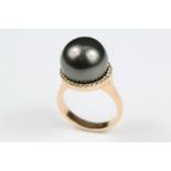 An 18ct Yellow Gold and Black Pearl Ring