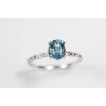An 18ct White Gold and Topaz Ring