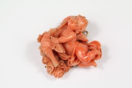 An Italian Renaissance-style Carved Coral Brooch