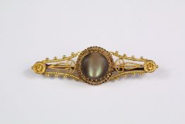 An Edwardian 15ct Yellow Gold and Cats Eye Brooch