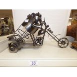 A METAL STEAM PUNK SCULPTURE OF A TRIKE - BOTTLE HOLDER