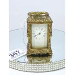 MINIATURE ORNATE BRASS CARRIAGE CLOCK WITH ENAMEL DIAL