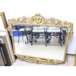 A MODERN ORNATE GILT FRAMED BEVELLED WALL MIRROR (80X80)