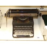 A BARLOCK TYPEWRITER WITH ORIGINAL COVER